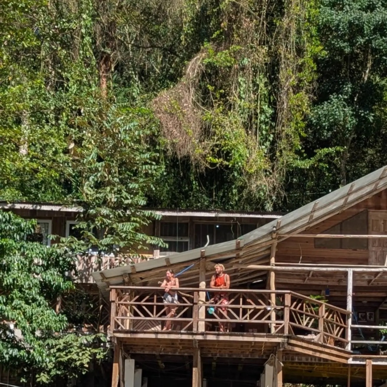 Jungle lodge surrounded by river and tropical landscape